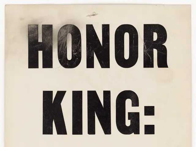 The image shows a poster with the words "Honor King End Racism" written in bold black lettering...