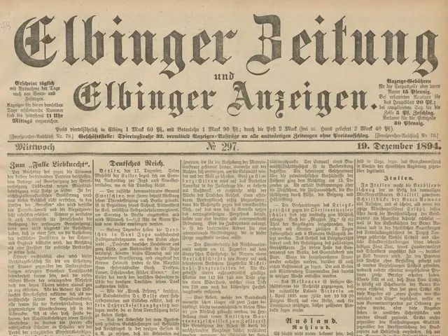 The image shows an old newspaper with a black and white image of a man's face on the front page....