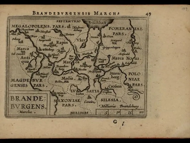The image shows an old book with a black background and a map of the Brandenburg region of Germany....