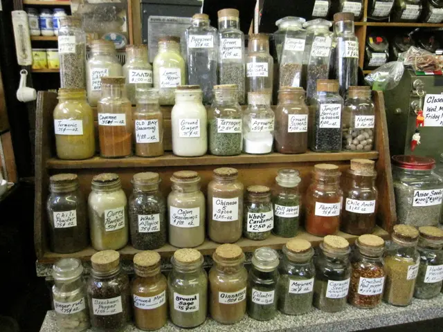The image shows a store with a countertop filled with lots of different types of spices, including...