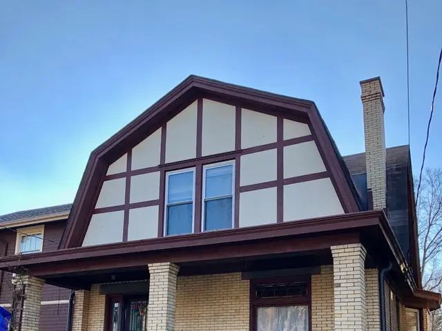 The image shows a two-story house with a brown roof and white trim, surrounded by windows, doors,...