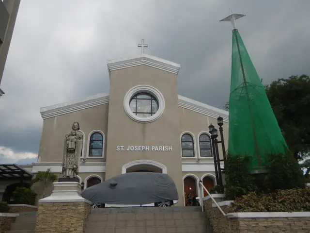 The image shows St. Joseph Parish Church in Manila, Philippines. It is a building with windows, a...
