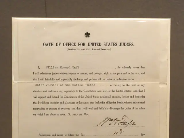 The image shows a paper with text on it placed on a table in front of a wall. The text reads "Oath...