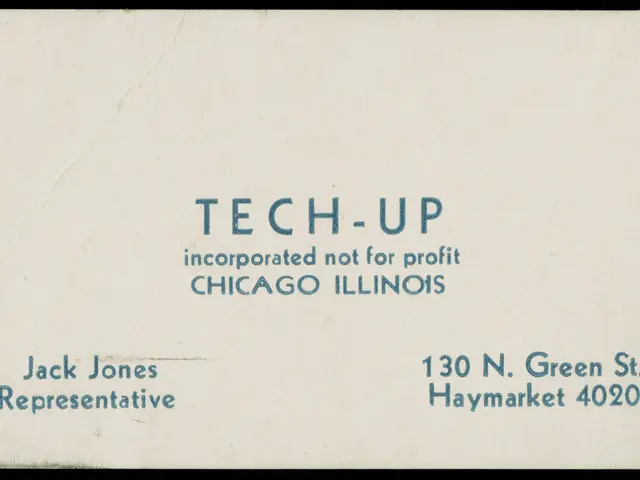 The image shows an old business card with the words "tech-up incorporated not for profit" written...