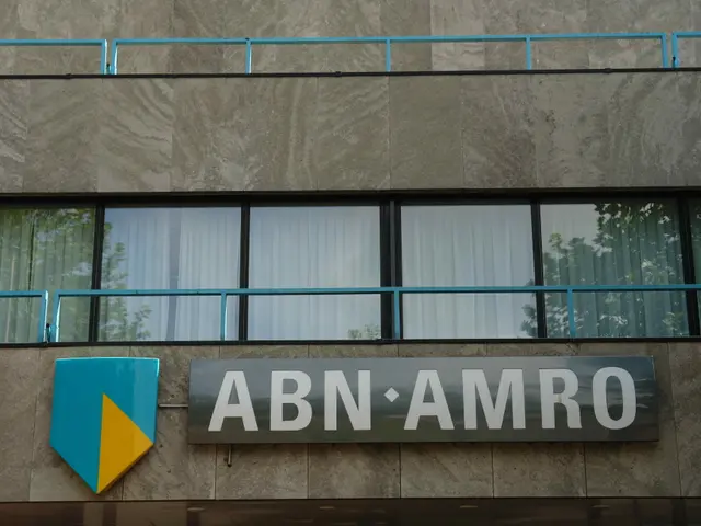 The image shows a building with a sign that reads "ABN AMRO" on the side of it, along with a board...