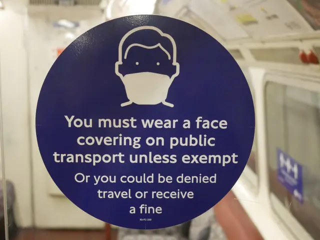 The image shows a sign on the door of a train that reads "You must wear a face covering on public...