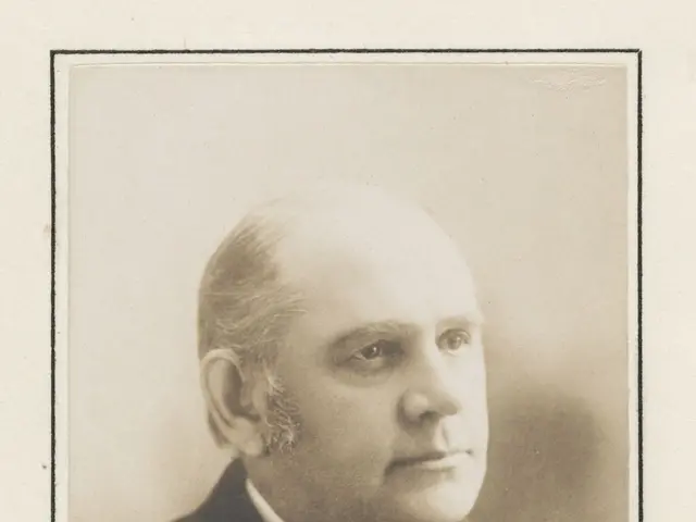 The image shows a black and white photo of Marcus A. Hanna, the U.S. Senator from Ohio, wearing a...