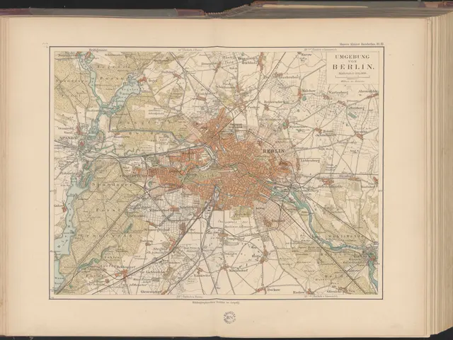 The image shows an open book with a map of Berlin on it. The map is detailed and shows the streets,...