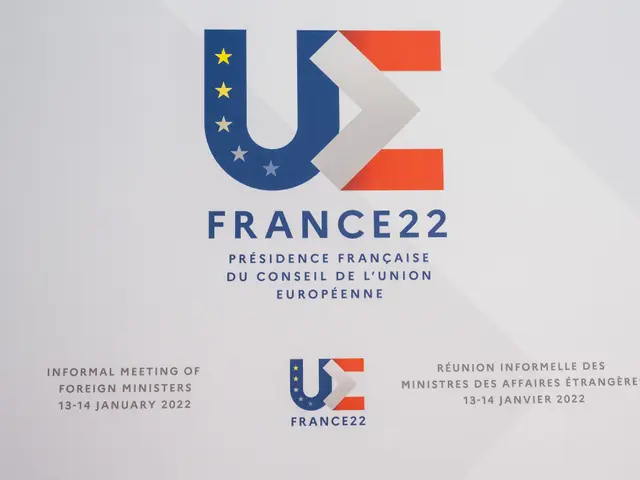 The image shows a poster with the text "France 22 - Informal Meeting of Foreign Ministers" and the...