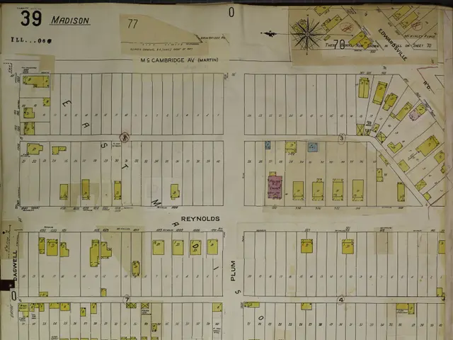 The image shows an old book with a map of the city of Madison, Wisconsin, with text and numbers on...