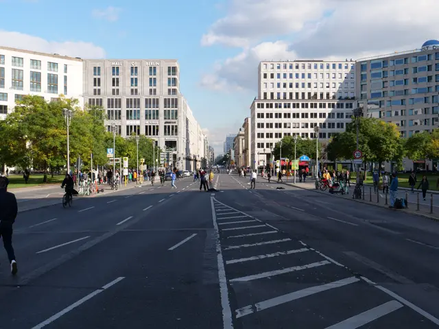 The image shows a bustling city street in Berlin, Germany, with people walking and riding bicycles...