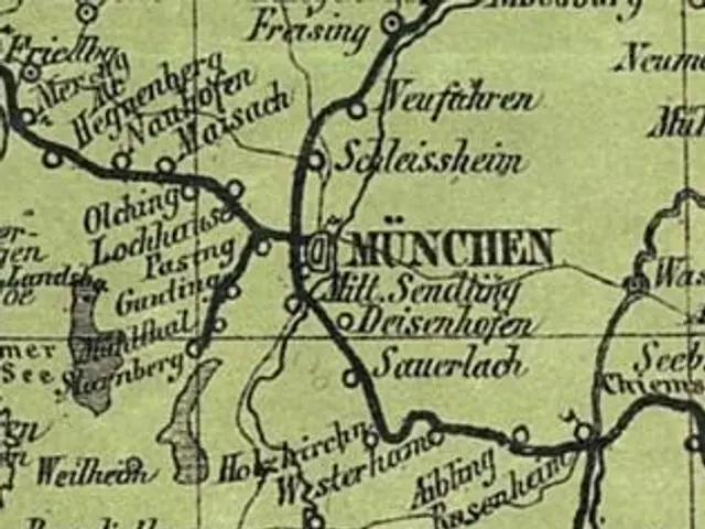 The image shows an old map of the city of Munich, Germany, with text written on it. The map is...