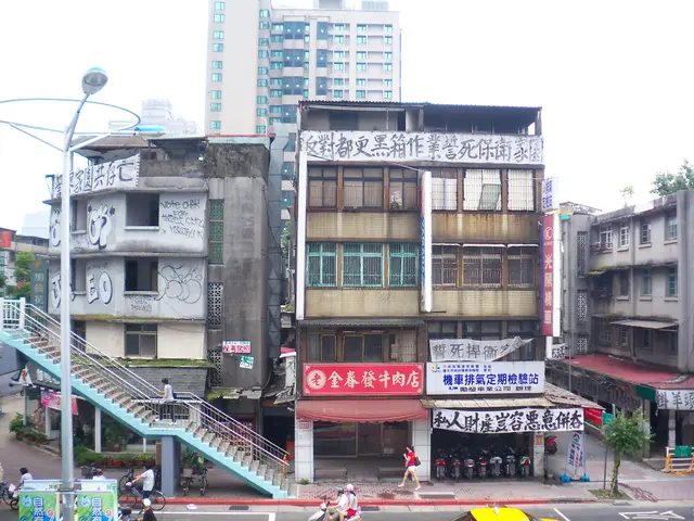 The image shows a city street filled with lots of tall buildings, street poles, street lights,...