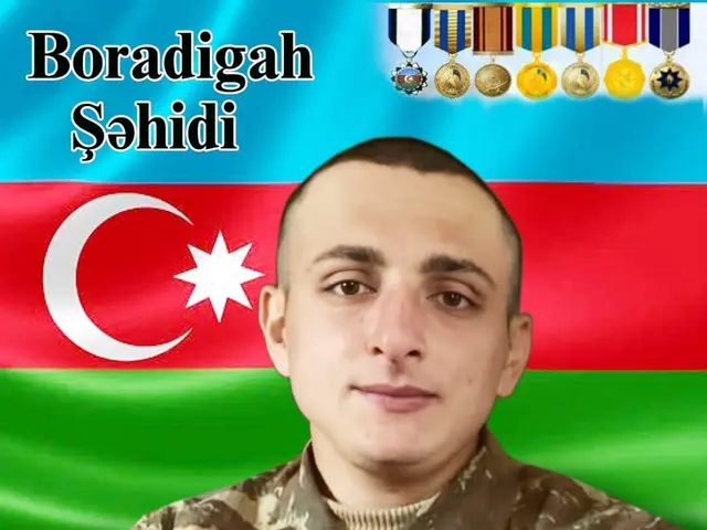 The image shows a poster of a man in military uniform with the Azerbaijani flag in the background....