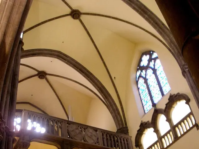 The image shows the interior of a church with a vaulted ceiling, arches, pillars, railings, lights,...