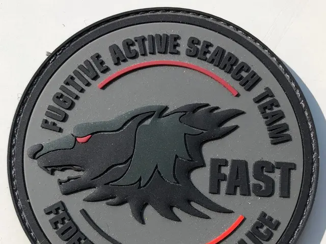 The image shows a white surface with a logo and text that reads "Fugitive Active Search Team Fast...