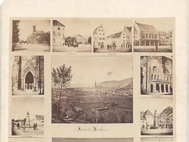 The image shows an old black and white photo of a city with a variety of buildings, trees, and...