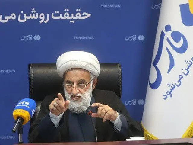 The image shows Ayatollah Ali Khamenei, the Supreme Leader of Iran, sitting on a chair wearing a...