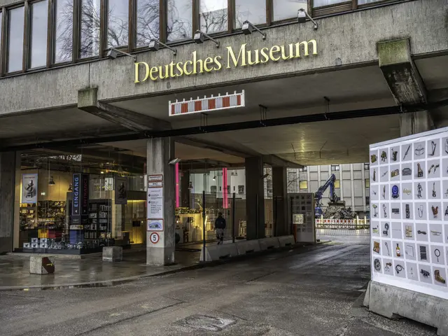 The image shows the Deutsches Museum in Berlin, Germany. It is a large building with glass windows,...