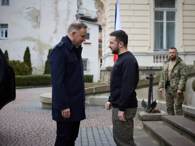The image shows two men standing next to each other in front of a building, with a car parked on...