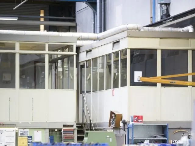 The image shows a large warehouse filled with lots of different types of equipment, including...