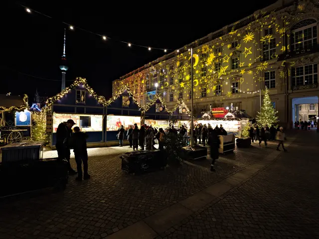 The image shows a bustling Christmas market in Berlin, Germany. There are many people gathered...