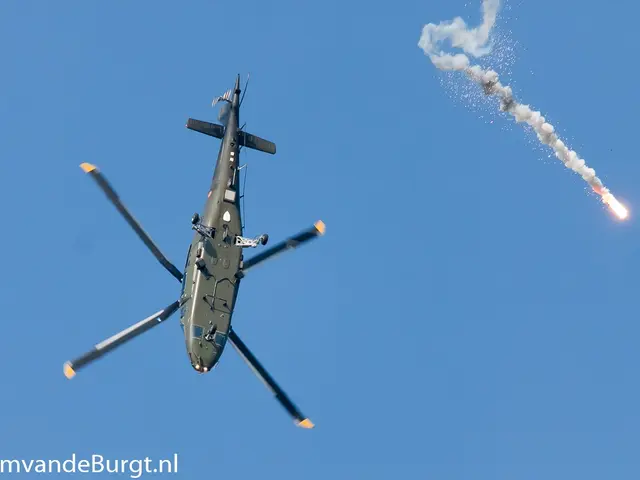 The image shows a military helicopter flying through the air with a missile in its hand, emitting...