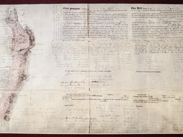 The image shows an old document with a map of the United States on it, framed in a photo frame. The...