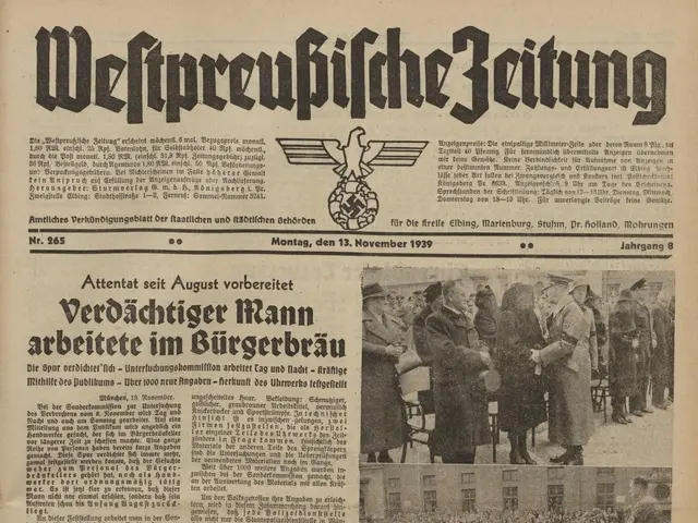 The image shows an old newspaper with a picture of a group of people on it. The newspaper is the...