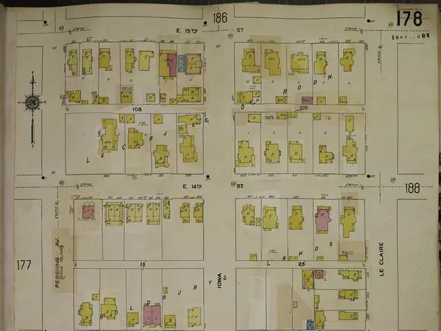 The image shows an open book with a map of a city on it. The map is detailed and shows the various...