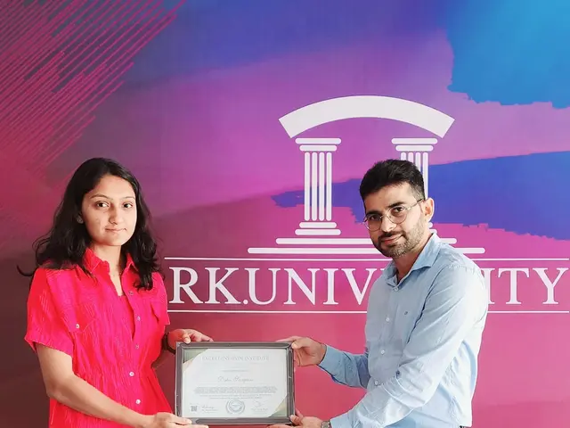 The image shows a man and woman standing next to each other, both holding a certificate. The man is...