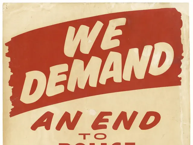 The image shows a poster with bold black text that reads "We Demand an End to Police Brutality...