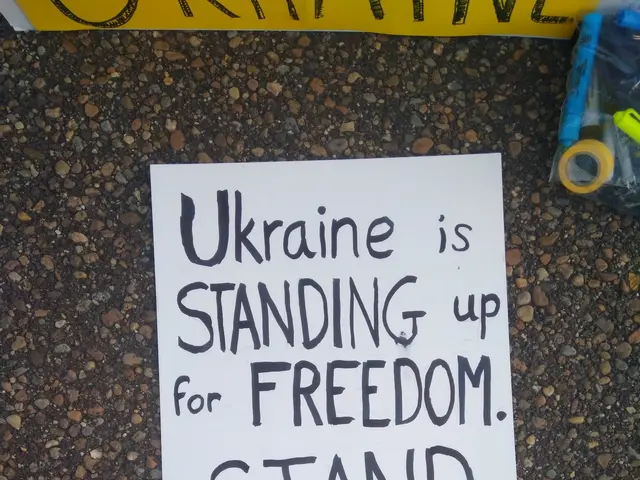 The image shows a white paper with the words "Ukraine is Standing Up for Freedom, Stand with...
