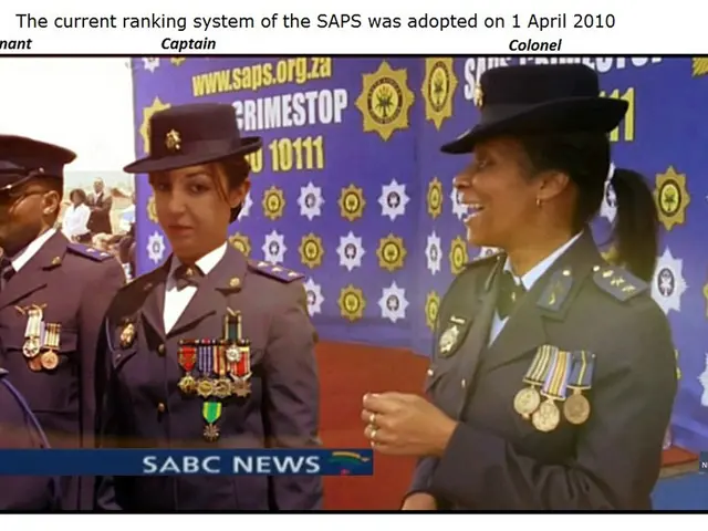 The image shows a group of people wearing uniforms and hats, with a banner in the background. At...