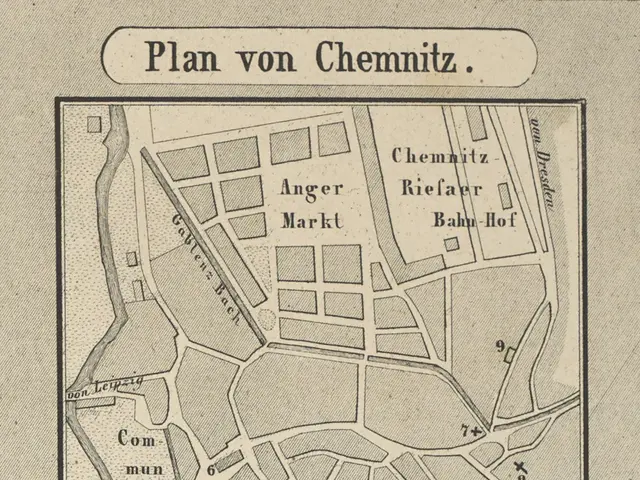 The image shows a paper with a map of the city of Chemnitz, Germany, with text written on it. The...
