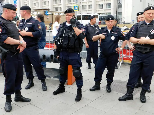The image shows a group of police officers standing next to each other on a sidewalk. They are...