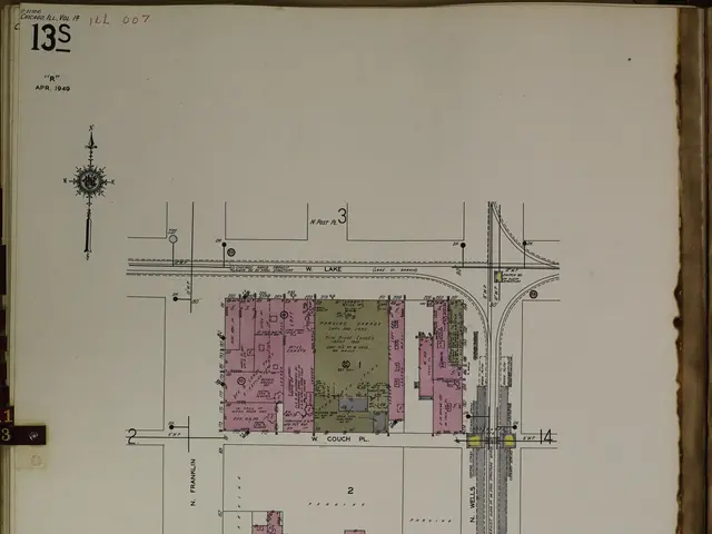 The image shows an open book with a drawing of a city on it. The book is filled with detailed plans...