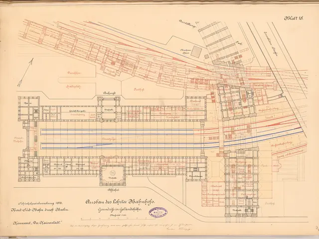 The image shows an old book with a map of a city on it. The map is detailed and shows the various...