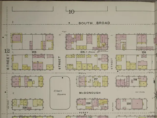 The image shows an old book with a map of a city on it. The map is detailed and shows the various...