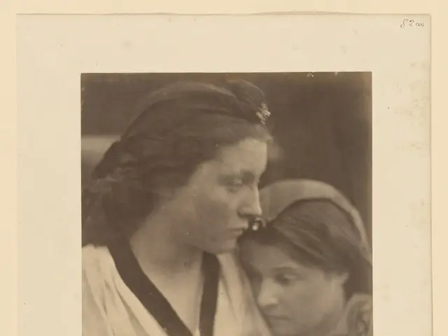 The image shows an old black and white photo of two women, one of whom appears to be a mother and...