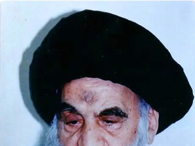 The image shows Ayatollah Ali Khamenei, the Supreme Leader of Iran, with a white background. He is...