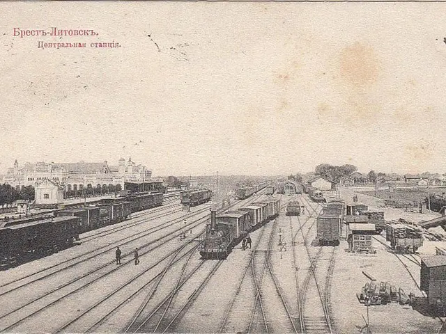 The image shows an old black and white photo of a train station in Moscow, Russia. There are...