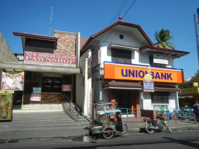 The image shows a building with a sign that reads "Union Bank" on the side of it, surrounded by...