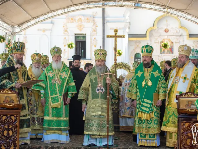 The image shows a group of priests standing in front of a church, with a person holding a book and...