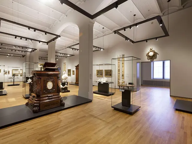 The image shows a large room filled with lots of different types of art, including sculptures,...