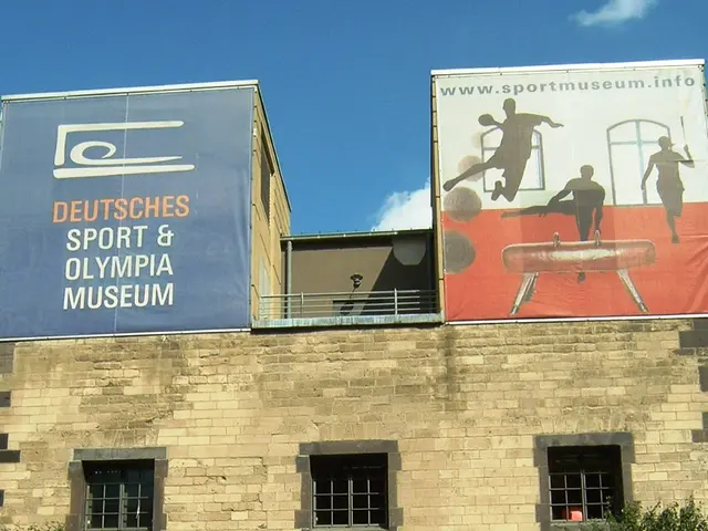 The image shows the Deutsches Sport & Olympic Museum in Berlin, Germany. It is a building with...