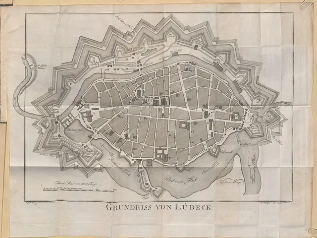 The image shows an old map of the city of Lübeck, Germany, with text written on it. The map is...