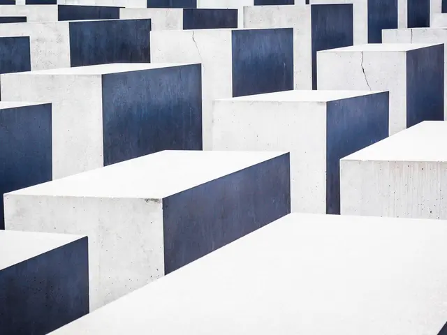 The image shows the Holocaust Memorial to the Murdered Jews of Europe in Berlin, Germany. It...