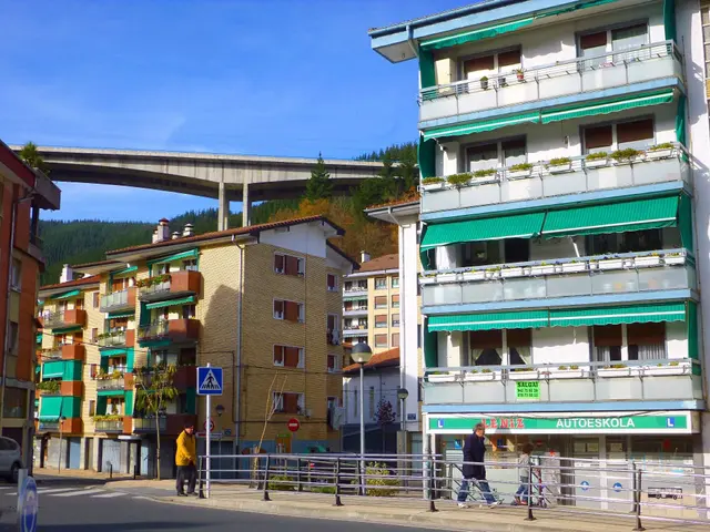 The image shows a city street with buildings, street poles, street lights, sign boards, motor...