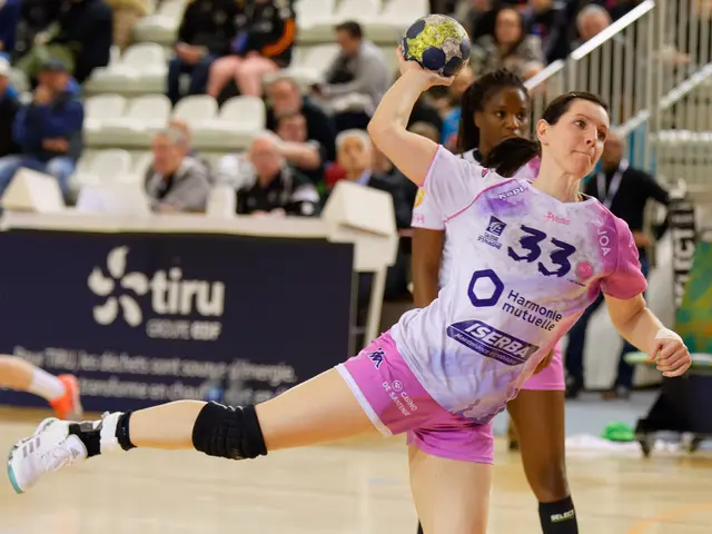 The image shows a group of women playing a game of handball on a court, with a ball in the center....